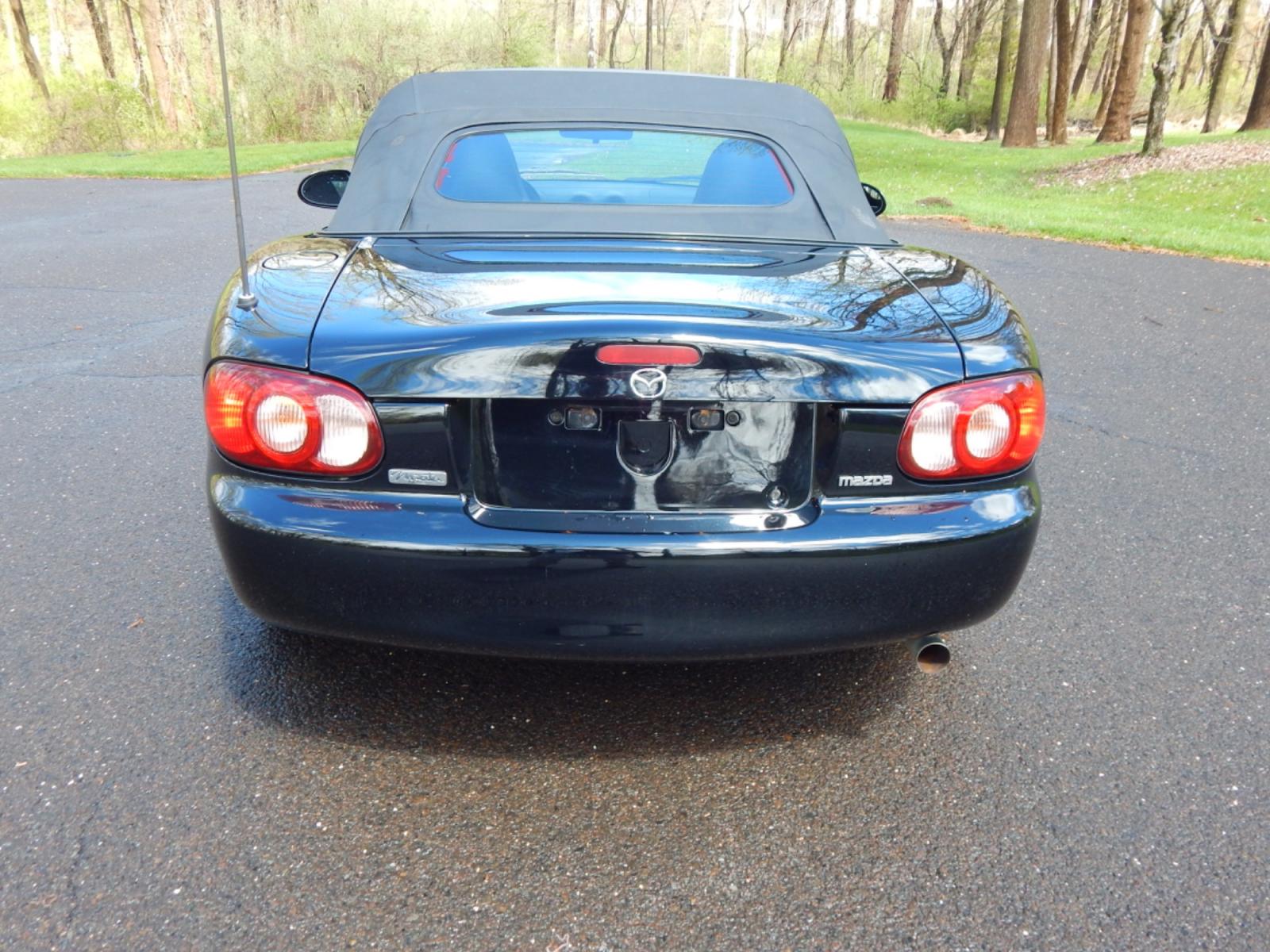 2002 Black /Black Cloth Mazda MX-5 Miata base (JM1NB353920) with an 1.8 liter 4 cylinder engine, 5 speed manual transmission, located at 6528 Lower York Road, New Hope, PA, 18938, (215) 862-9555, 40.358707, -74.977882 - Here for sale is a very fun 2002 Mazda MX-5 Miata. Under the hood is a strong running 1.8 liter 4 cylinder which puts power to the rear wheels via a solid shifting 5 speed manual transmission. Features include; Black cloth interior, wood grain trim, cold AC, power windows, AM/FM/CD, heated rear wi - Photo #13